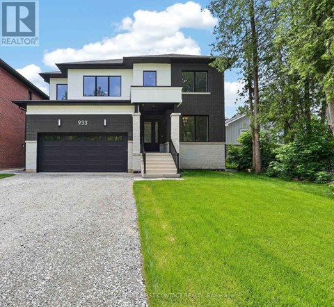 A modern house with a garage and a driveway.