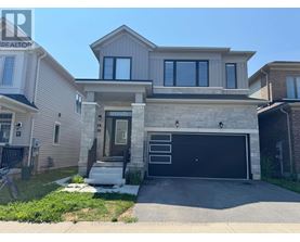 A two-story house with a garage is for sale.