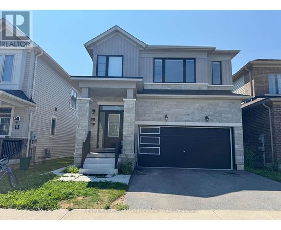 A two-story house with a garage is for sale.