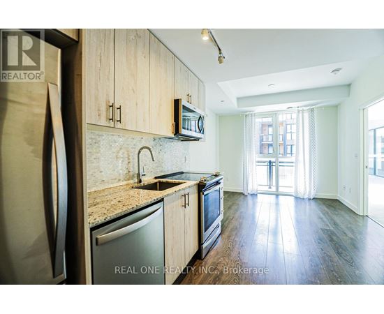 A kitchen with wooden cabinets and a granite countertop.