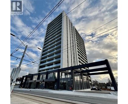 A tall building with a modern design stands prominently in the foreground.
