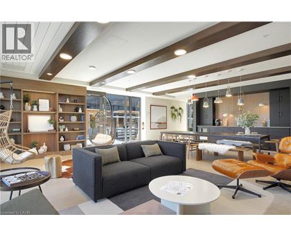 A modern living room with a grey sofa and a coffee table.