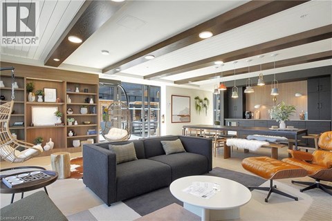 A modern living room with a grey sofa and a coffee table.