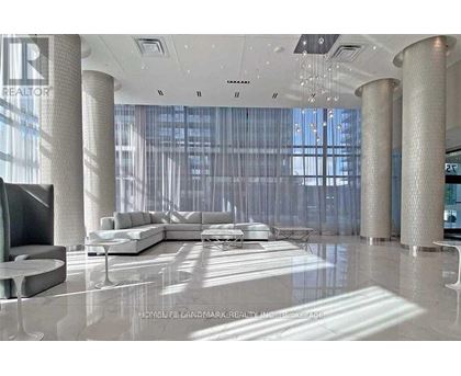 A modern living room with a large sectional sofa and a television.