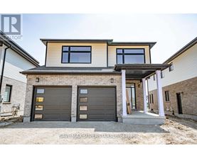 A modern house with a garage and a covered entryway.