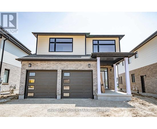 A modern house with a garage and a covered entryway.