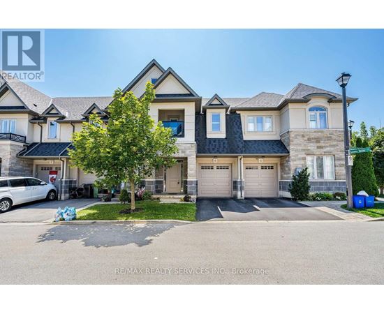 A large house with a car parked in front.
