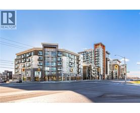 A street view of a residential area with apartment buildings and a REALTOR® logo.