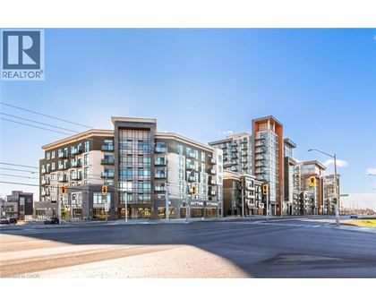 A street view of a residential area with apartment buildings and a REALTOR® logo.