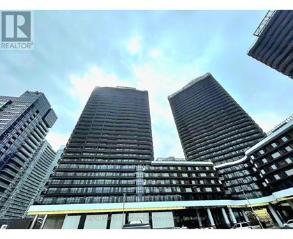 Three tall buildings are seen from a low angle.