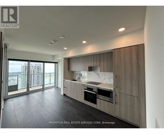 A modern kitchen with a view of the city.