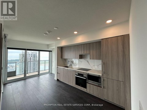 A modern kitchen with a view of the city.