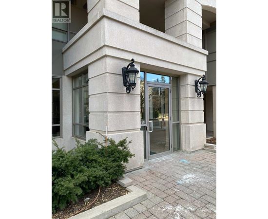 A building with a glass door and a sign that says REALTOR.