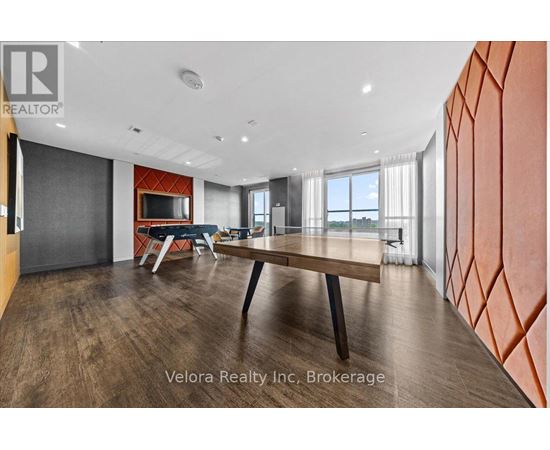 A modern dining room with a wooden table and chairs.