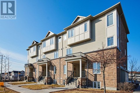 A large residential building with a balcony on the second floor.