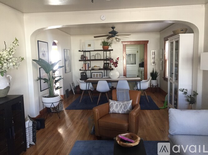 A living room with a brown leather chair in the center.