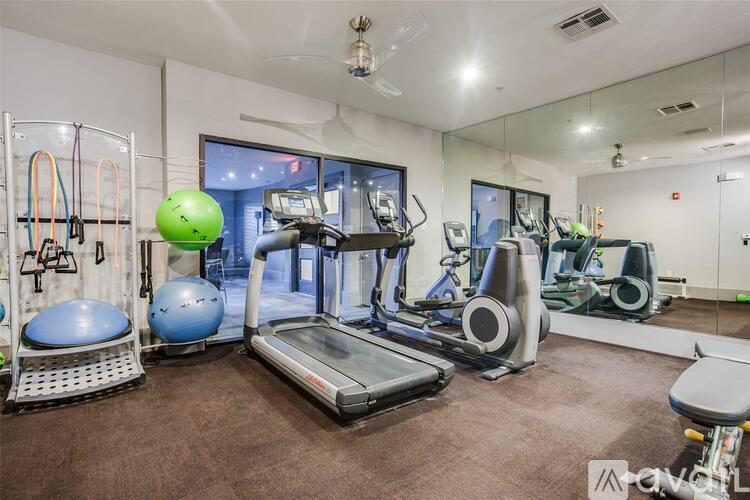 A well-equipped gym with a variety of exercise machines and equipment.