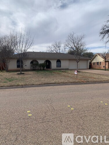 A house with a sign in front of it.