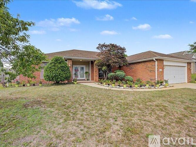 A house with a lawn in front of it.