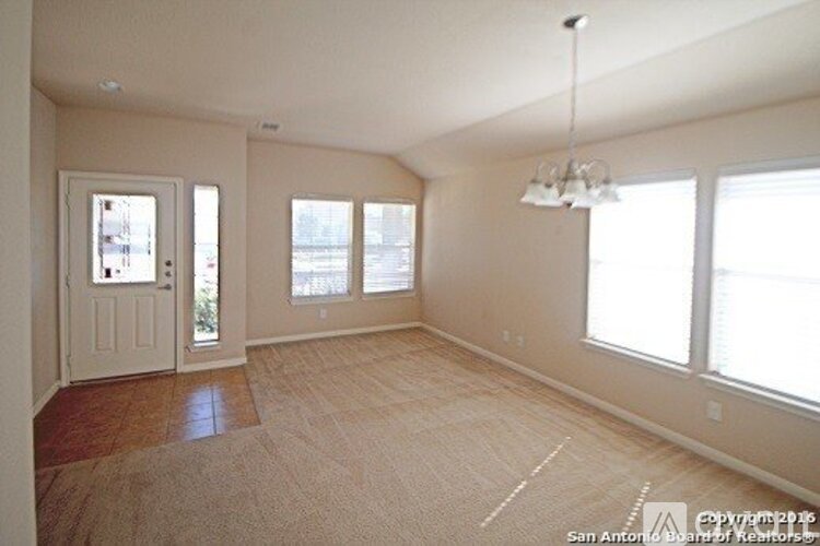 Empty room with white walls and a door.