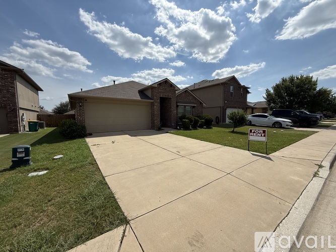A house with a for sale sign in front of it.