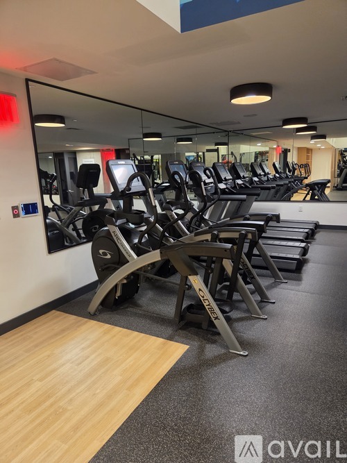 A gym with treadmills and exercise equipment.