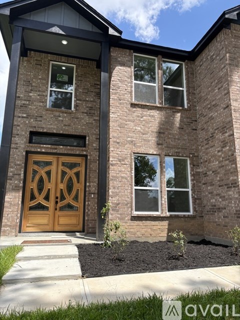 A house with a brown door and windows.