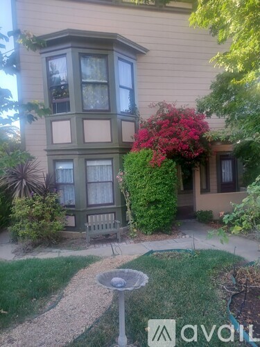 A house with a garden in front of it.