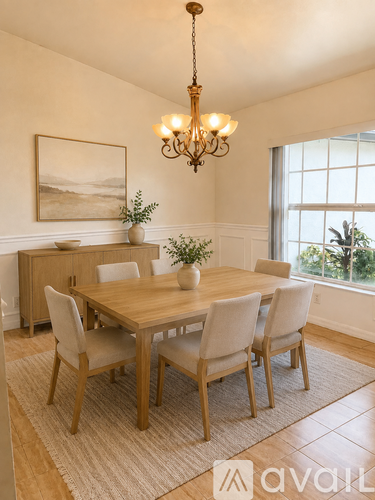 A dining room with a wooden table and chairs.
