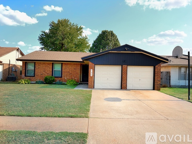 A house with a garage is for sale.
