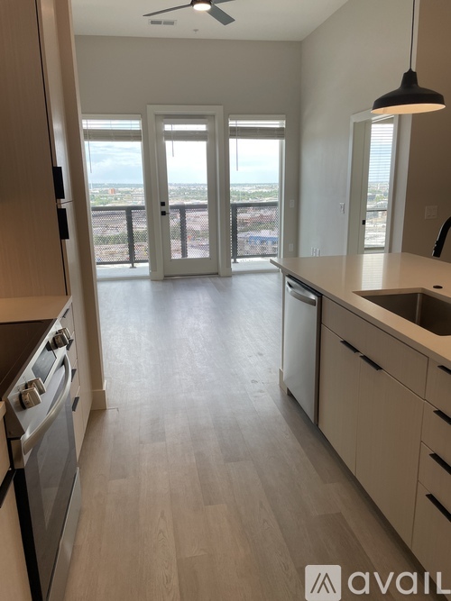 A kitchen with a view of the city.