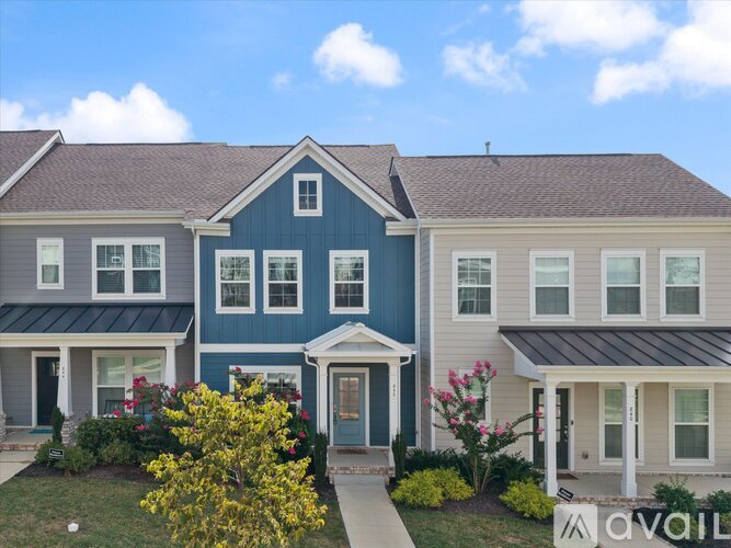 A row of houses with the front door of the blue one highlighted.