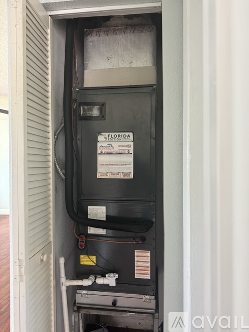 A Florida Sections HVAC unit is installed in a wall.