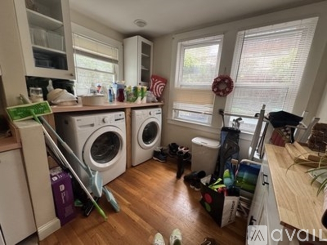 A laundry room with a washer and dryer stacked on top of each other.