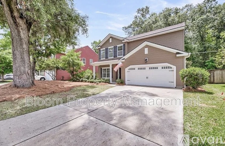 A house with a driveway in front of it.