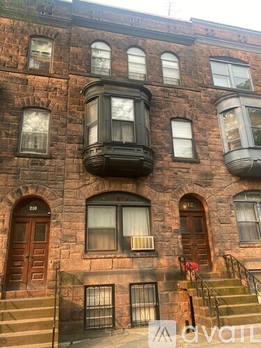 A building with the number 210 on it.
