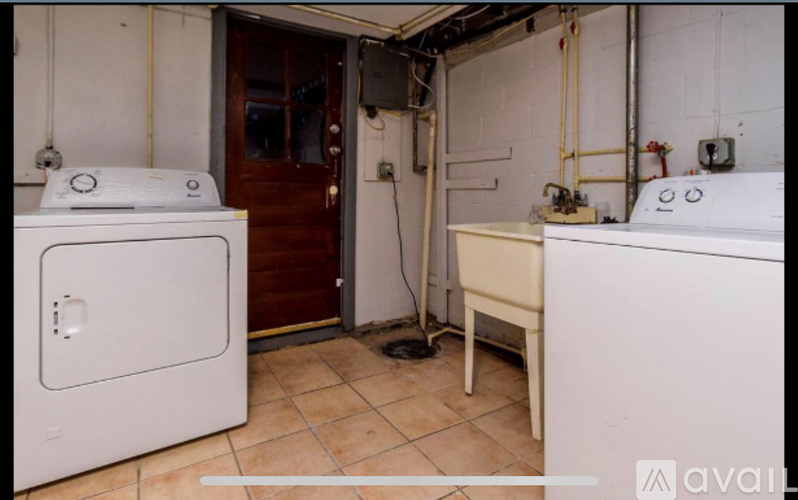 A laundry room with a washing machine and a dryer.
