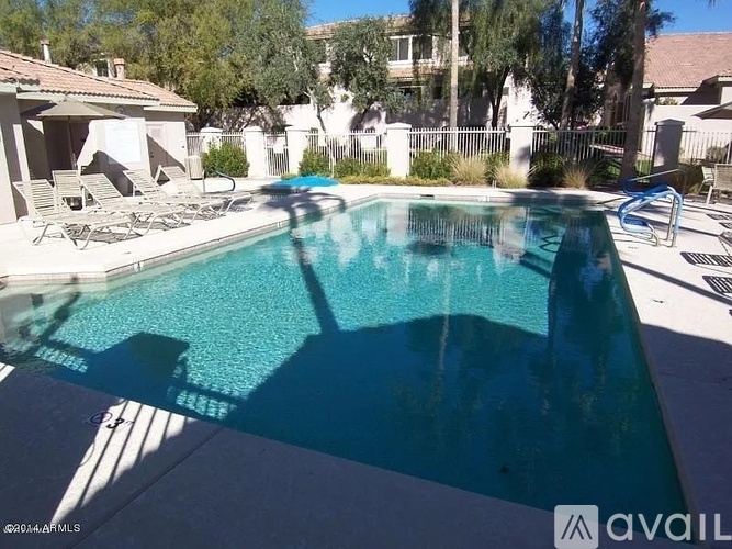 A pool with a blue tinted water.