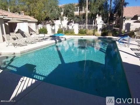 A pool with a blue tinted water.