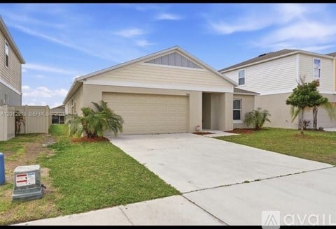 A house with a garage is for sale.