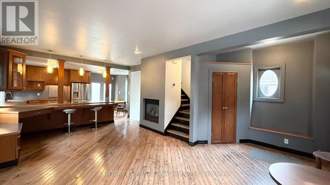 A spacious open floor plan with a kitchen, dining area, and living room.