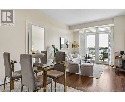A dining room with a glass table and chairs.
