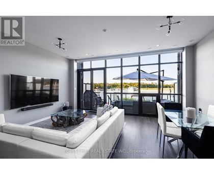 A modern living room with a large white sofa and a glass table.