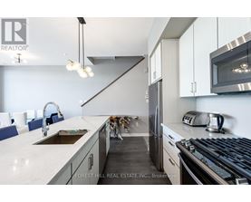 A modern kitchen with Forest Hill Real Estate Inc. logo.