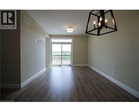 A room with a wooden floor and a large window.