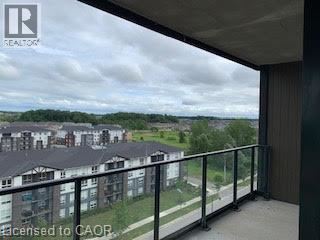 A balcony with a view of apartment buildings.