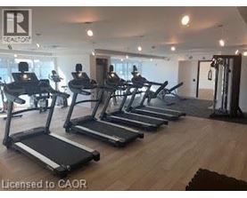 A gym with treadmills and a sign that says Realton.