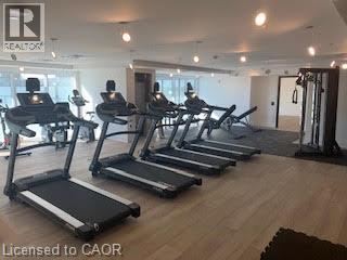 A gym with treadmills and a sign that says Realton.