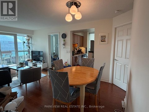 A dining room with a table and chairs is shown.