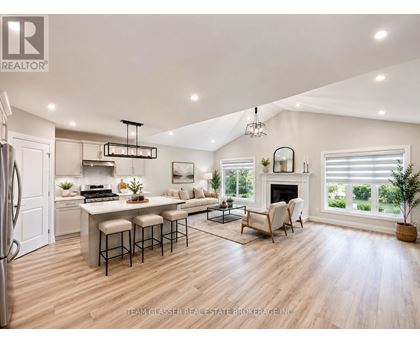 A well-lit, modern kitchen with a dining area and a bar.